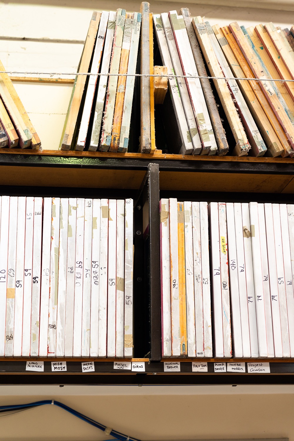 A library of well-used screen printing frames